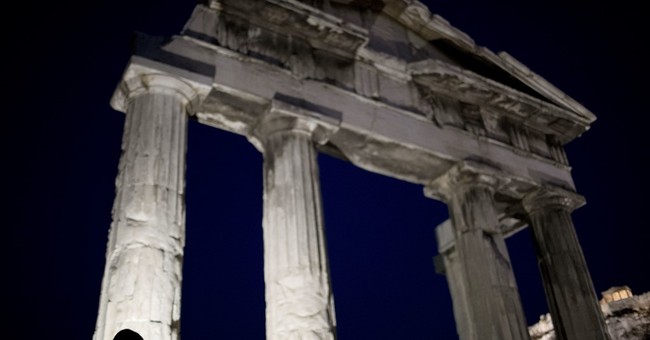 IMF approves conditional $1.8 billion loan to Greece